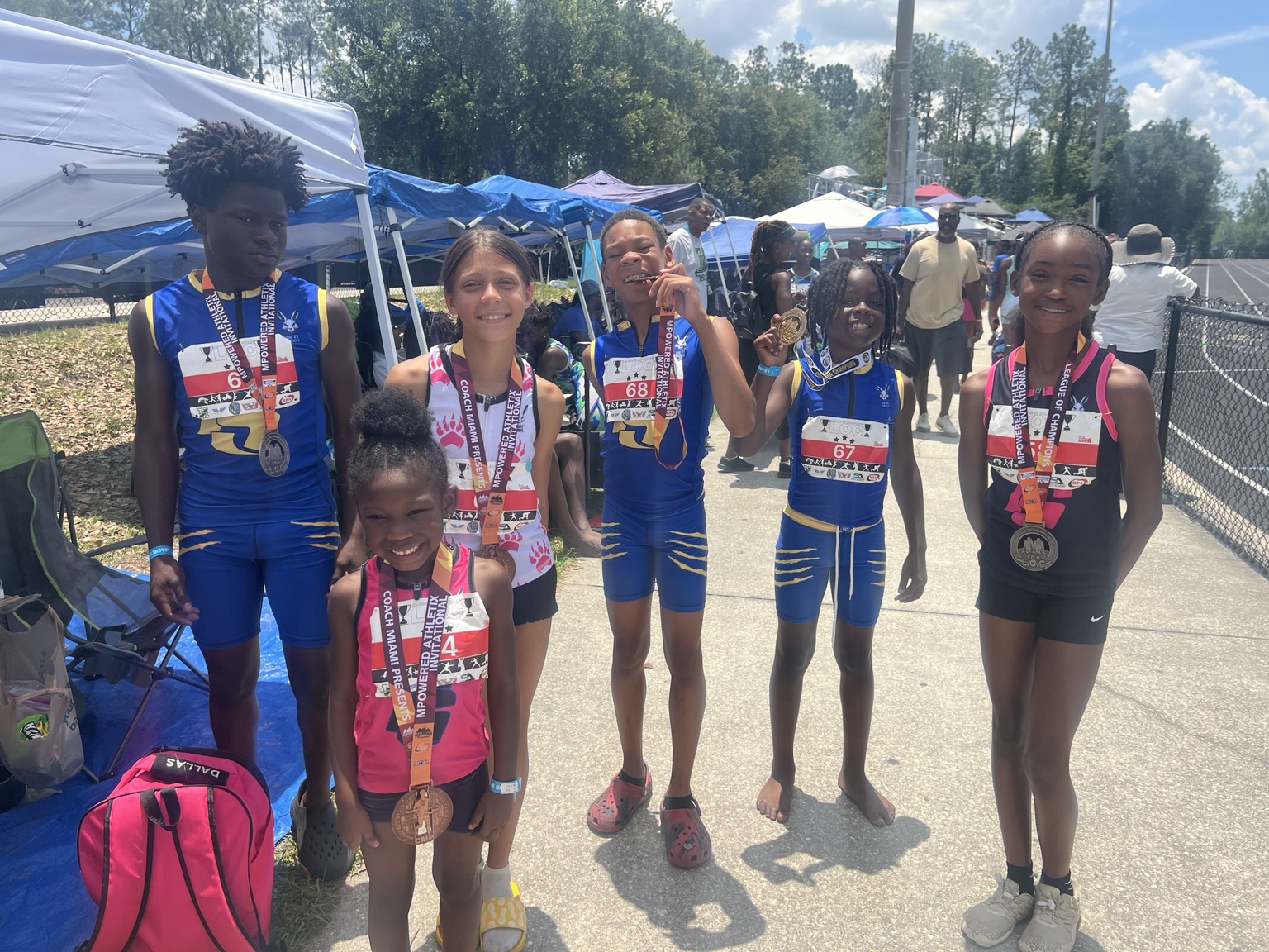 Group of FS NextGen athletes showing medals together