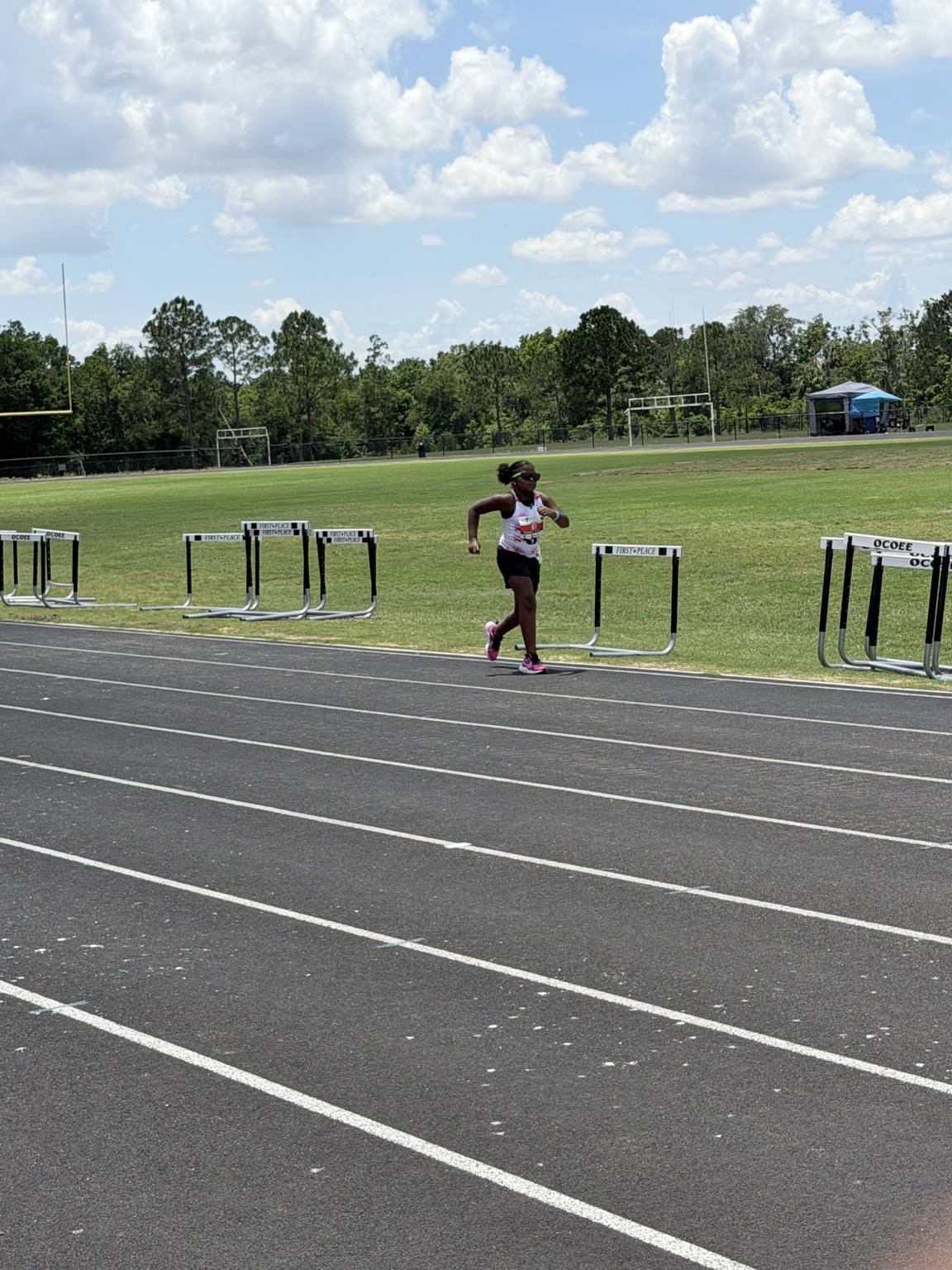 Young athlete running on the track during competition